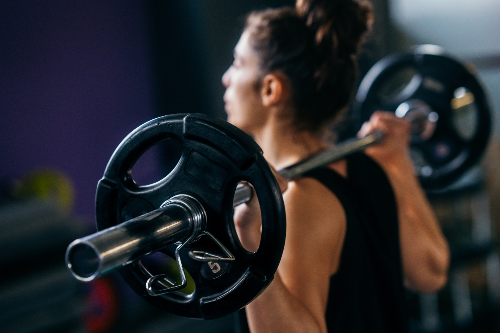 Woman Lifting a Barbell